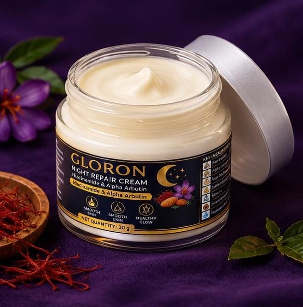 Open jar of GLORON Night Repair Cream showing the white cream, with the silver lid leaning beside it